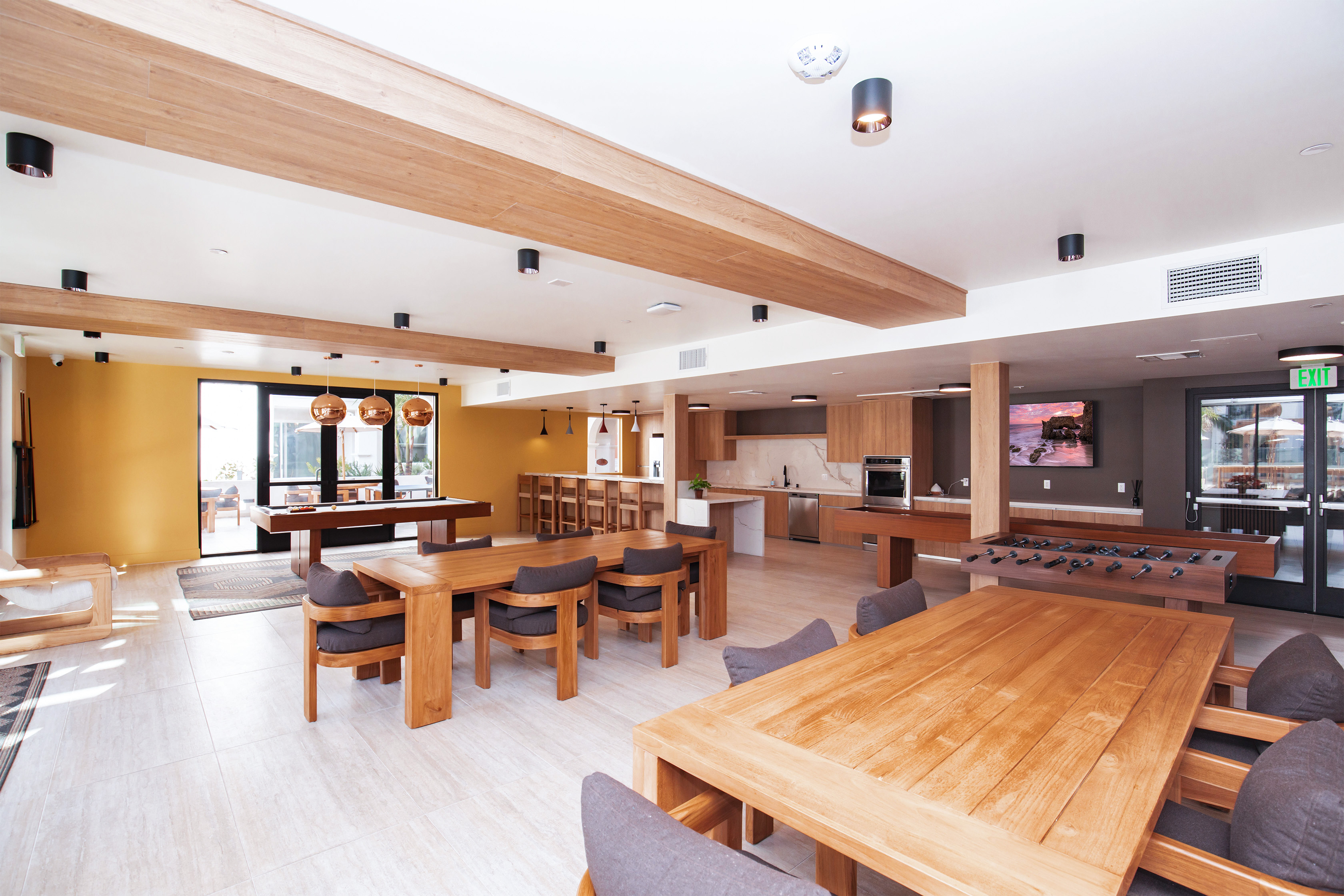 clubhouse with a kitchen, tables, and games