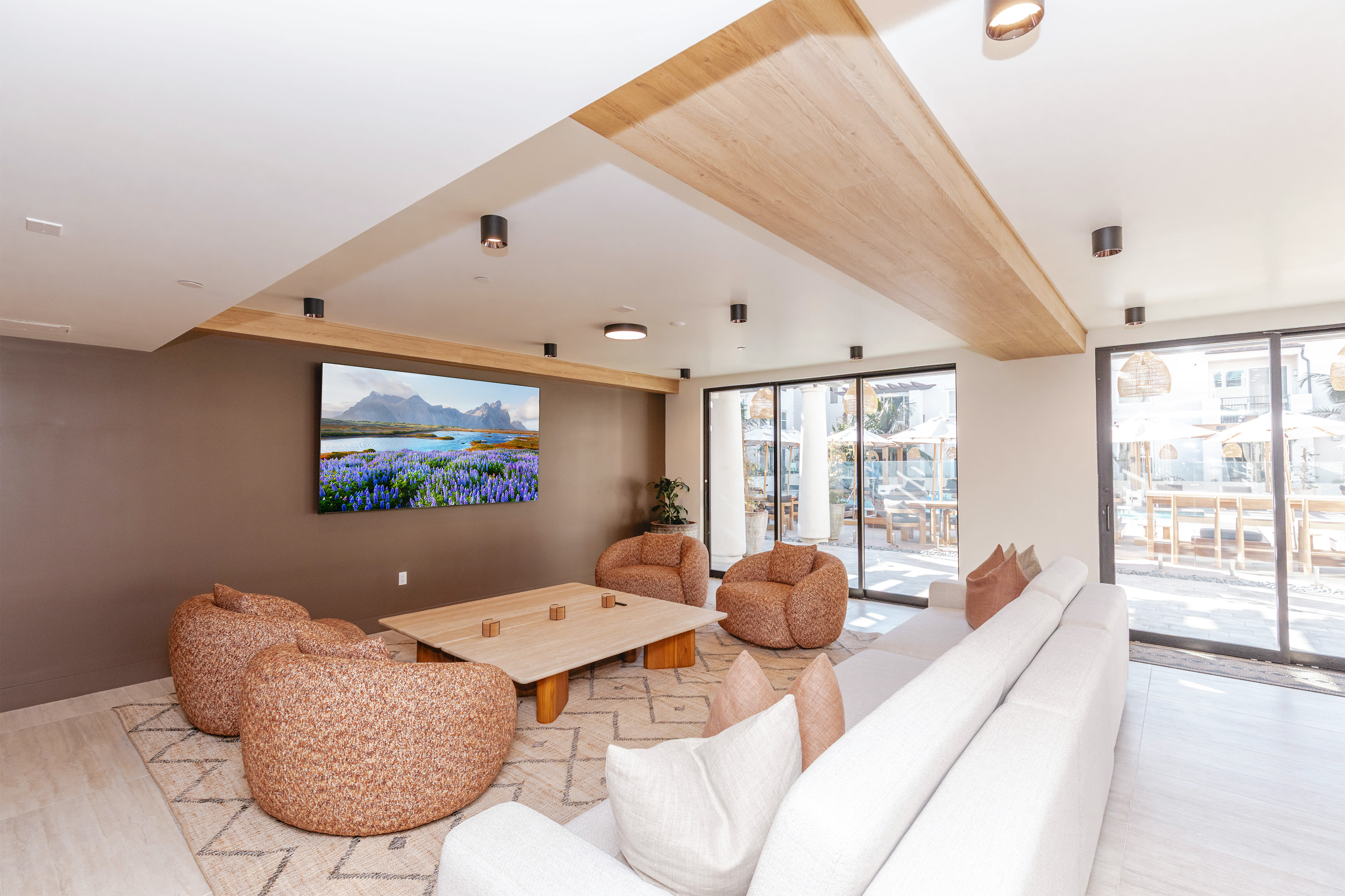 clubhouse with coffee table, plush chairs, and couch